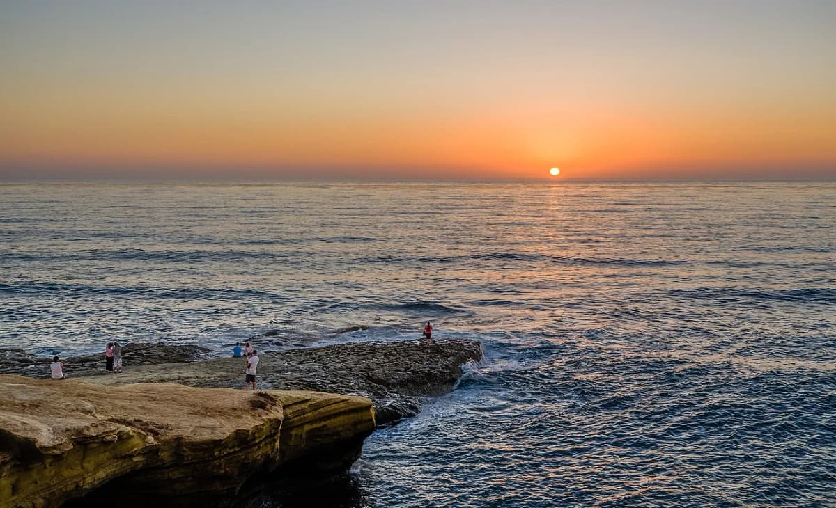 Sunset Cliffs Natural Park dramatic sandstone cliffs dropping into the Pacific Ocean at golden hour