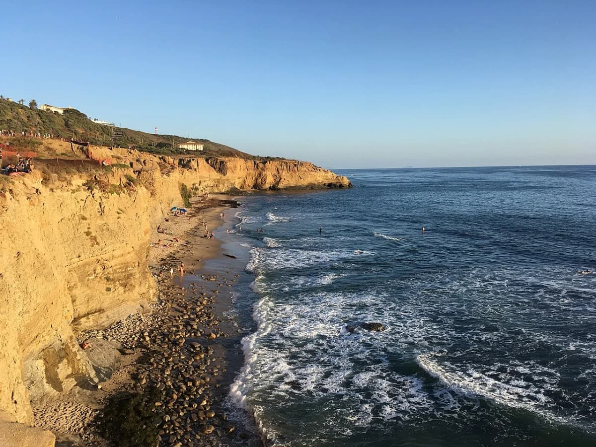 Waves surging through sea cave at Sunset Cliffs Natural Park in Ocean Beach San Diego