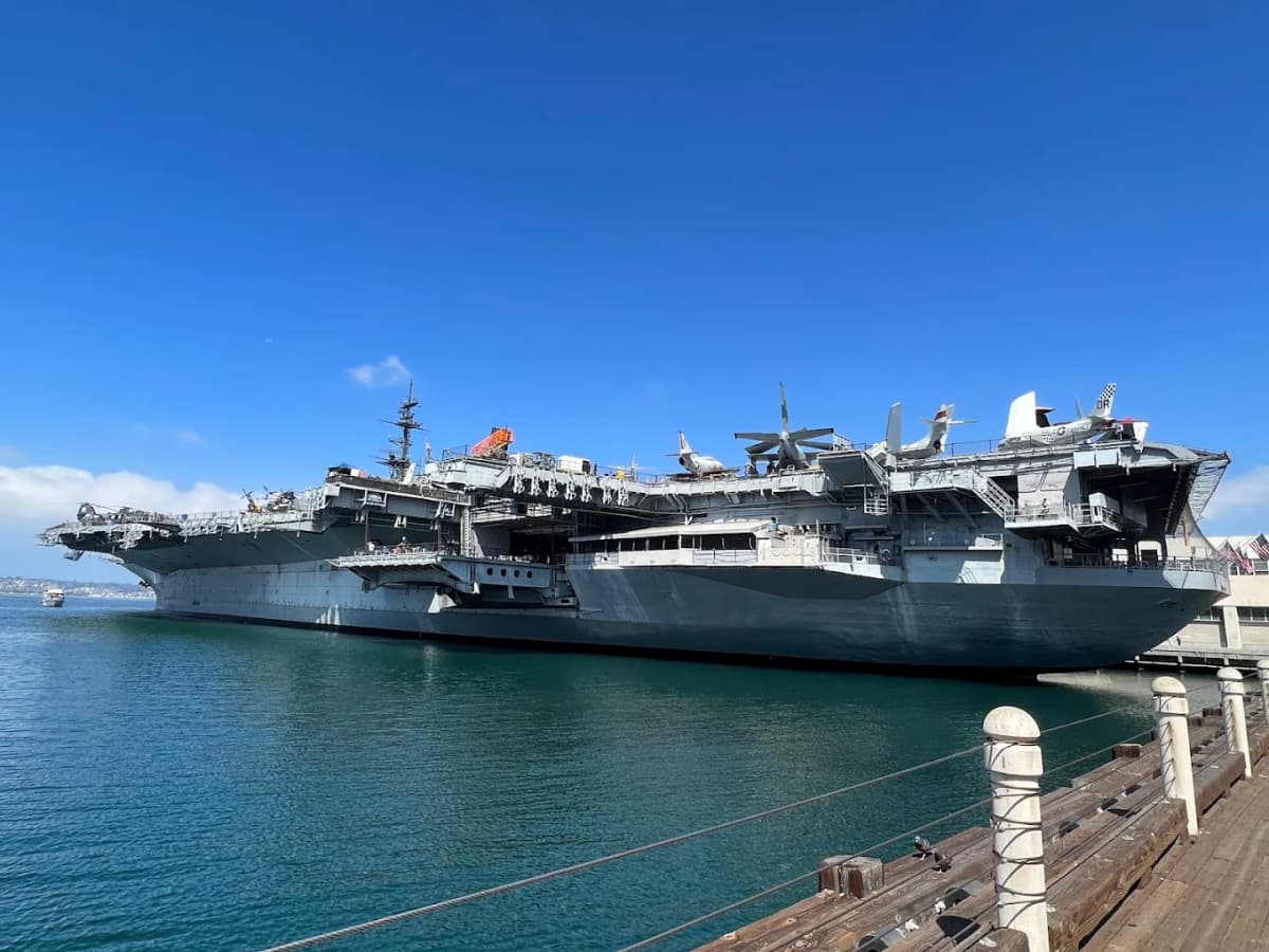 USS Midway Museum CV-41 aircraft carrier docked on San Diego's Embarcadero waterfront with aircraft on flight deck